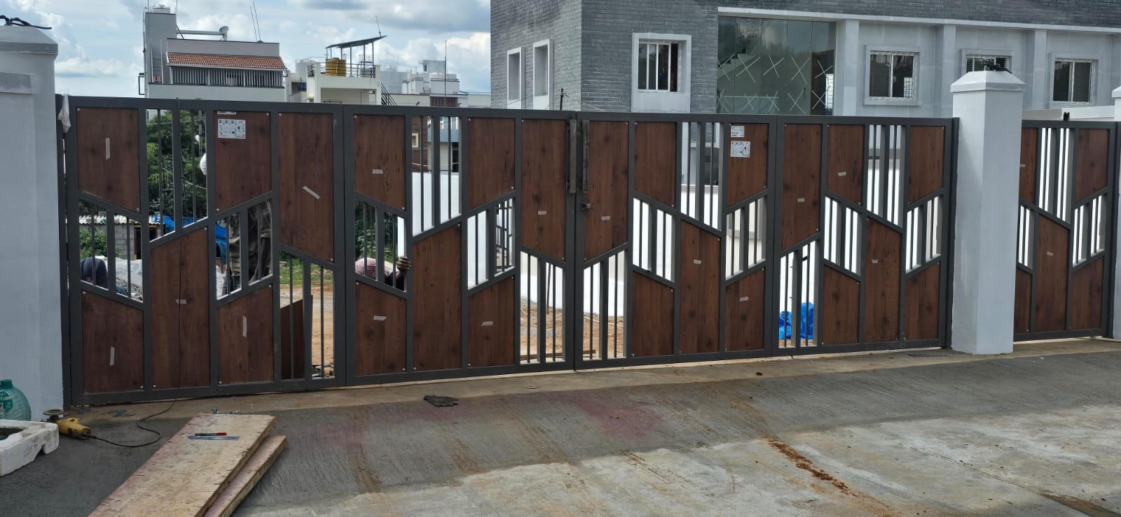 Custom wood-finish metal house entrance gate