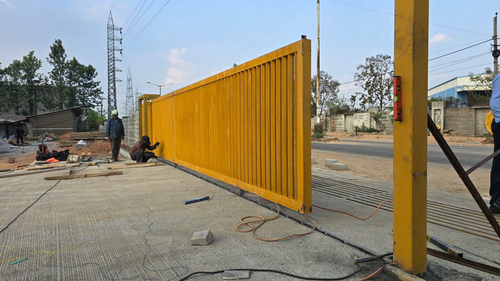 Orange sliding gate during installation