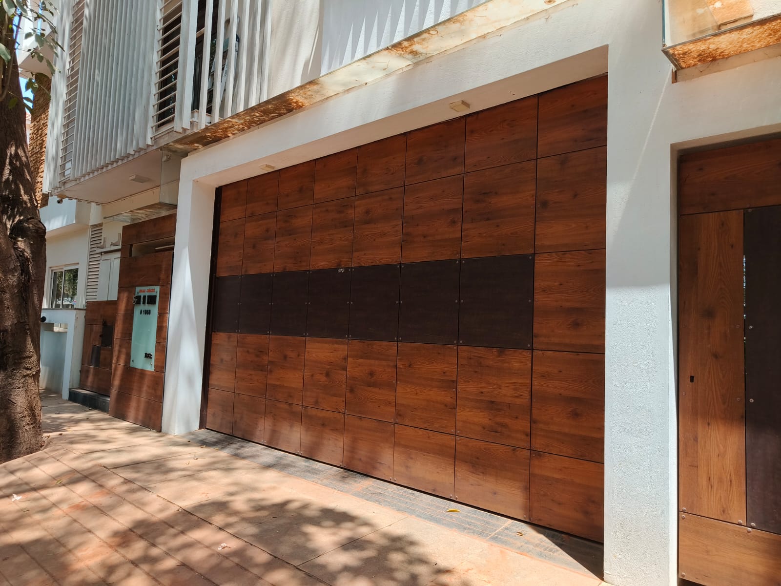 Timber-look entrance shutter at a home