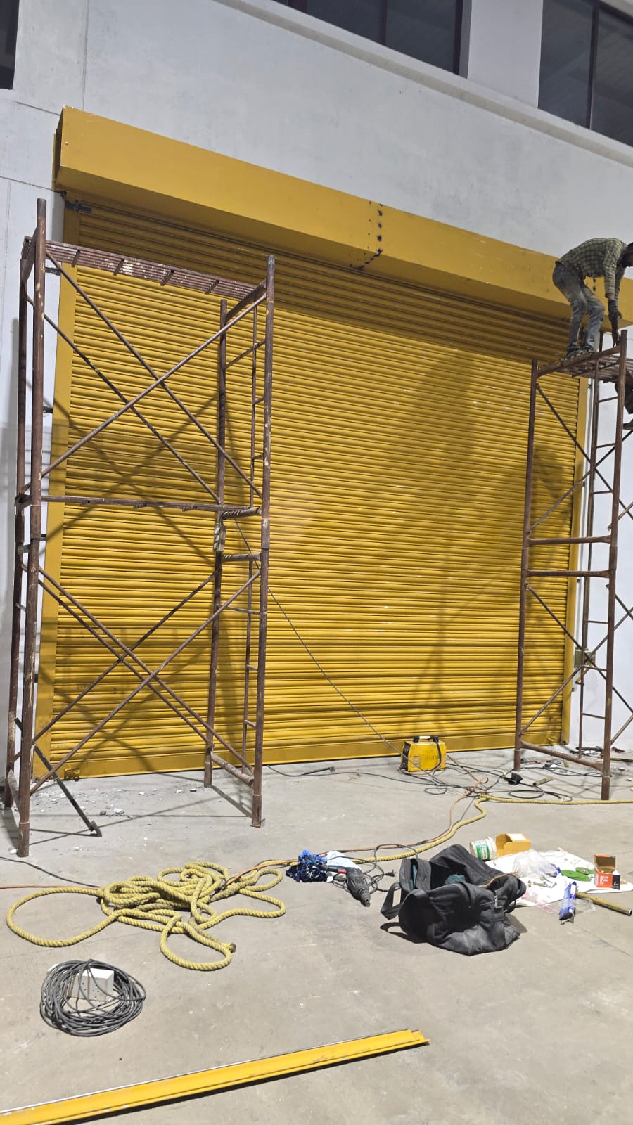 Large yellow rolling shutter during installation